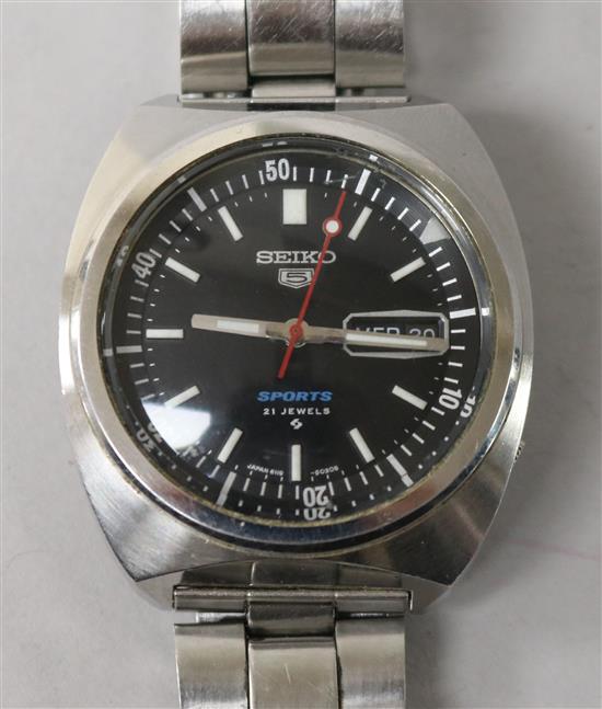 A gentlemans steel Seiko 5 Sports wrist watch.